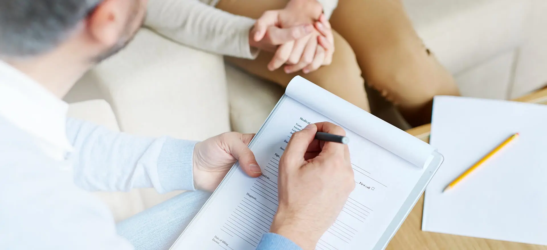 Male hands making notes in document